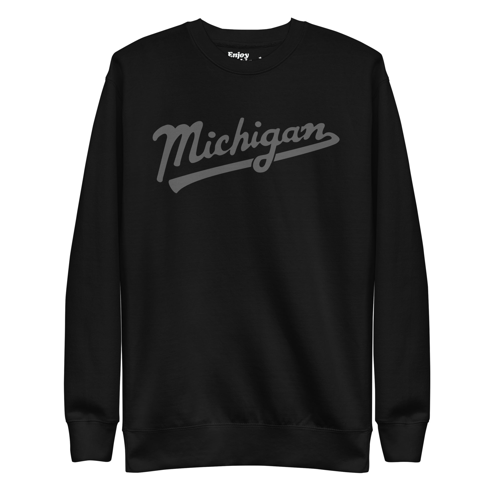 Michigan Script premium sweatshirt shown in black with a gray sport-style script graphic printed on the front. By Enjoy Michigan