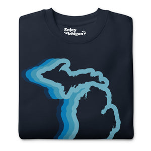 Michigan 70's Premium Sweatshirt shown in navy with a blue color wave of the state of Michigan. By Enjoy Michigan