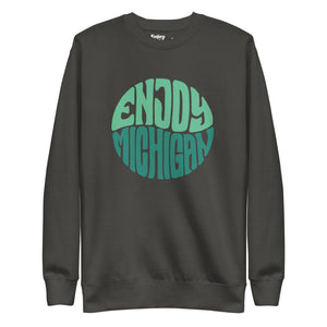 Enjoy Michigan 70's Retro Premium Sweatshirt shown in vintage black with a throwback 70's Enjoy Michigan circular graphic printed on the front. By Enjoy Michigan.