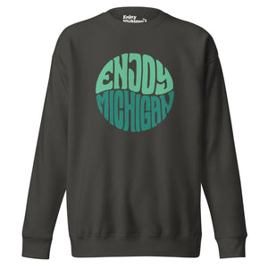 Enjoy Michigan 70's Retro Premium Sweatshirt shown in vintage black with a throwback 70's Enjoy Michigan circular graphic printed on the front. By Enjoy Michigan.